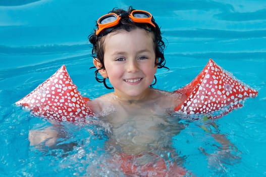 Child in the pool on holiday