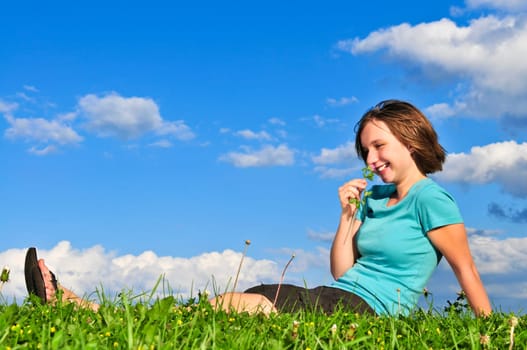 Young girl sitting on grass