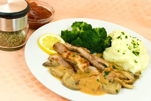 Fillet slices with mushroom cream sauce