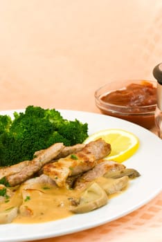 Fillet slices with mushroom cream sauce