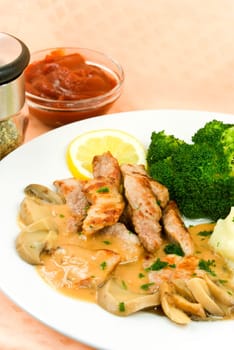 Fillet slices with mushroom cream sauce