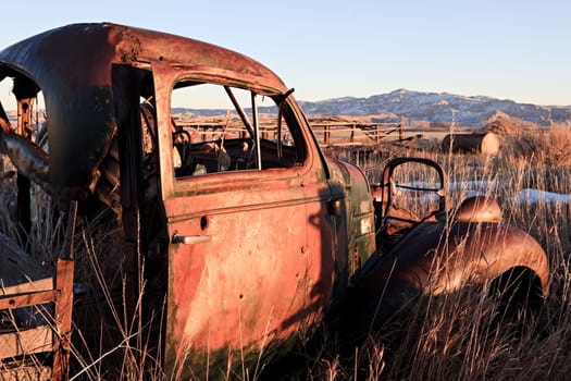 abandoned car in field