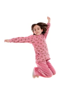 Joyful little girl jumping
