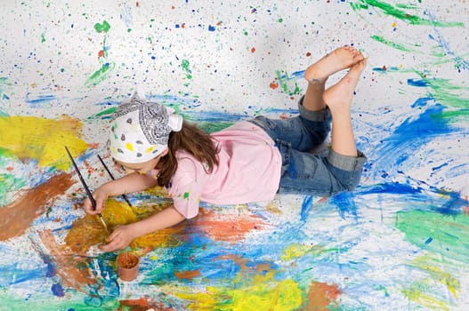 Girl playing with painting