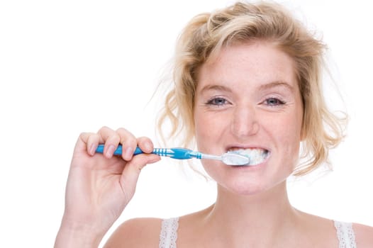 Young woman brushing her teeth