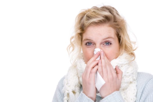 Woman blowing her nose