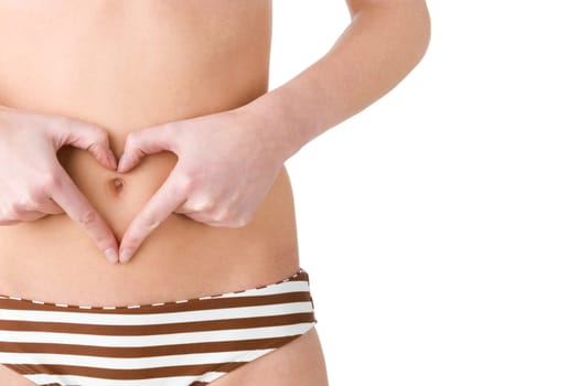 Woman with heart symbol in front of belly