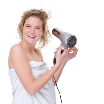 Young woman blow-drying her hair