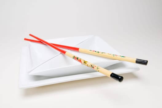 chopsticks on the plate cross right