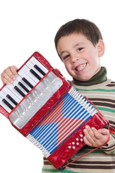 Adorable child playing red accordion