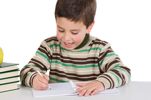 Adorable child writing in the school