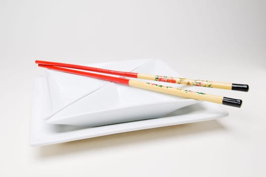 chopsticks on the plate parallel right