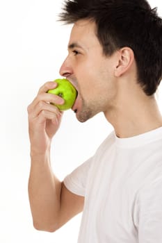 Man eating green apple