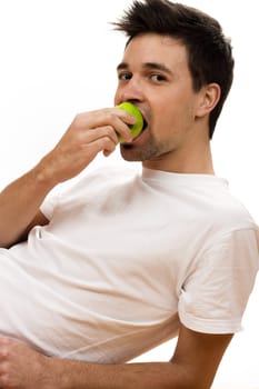 Man eating green apple