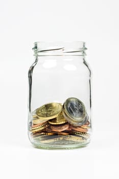 A jar with some small Euro coins inside