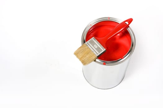 Red paint can with brush isolated