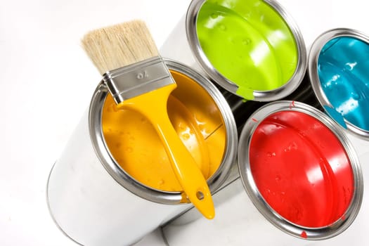 Opened paint buckets with paintbrush