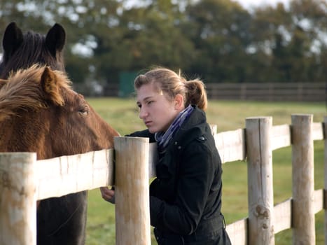 Teenage girl with a horse