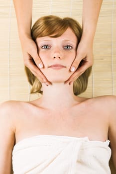 young woman having a facial massage