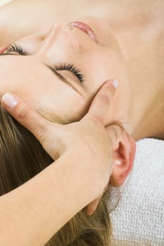 young woman having a facial massage