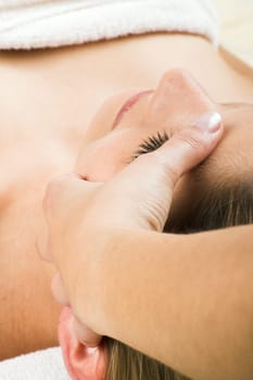 young woman having a facial massage