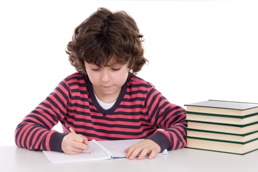 Adorable child writing in the school