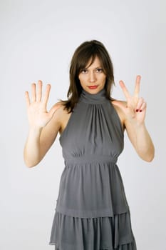 Model showing with hand number eight