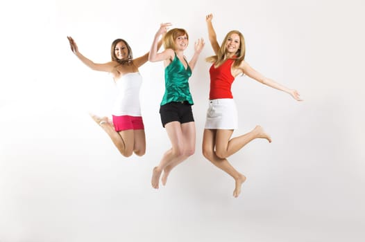 three young woman jumping