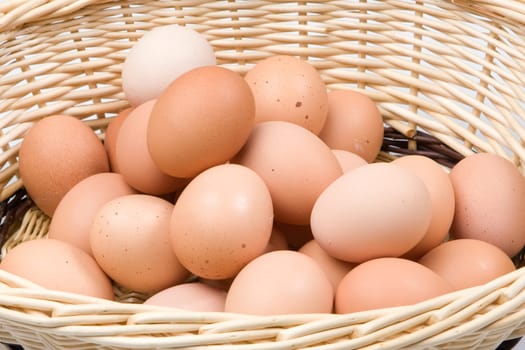 Basket with a lot of hen eggs