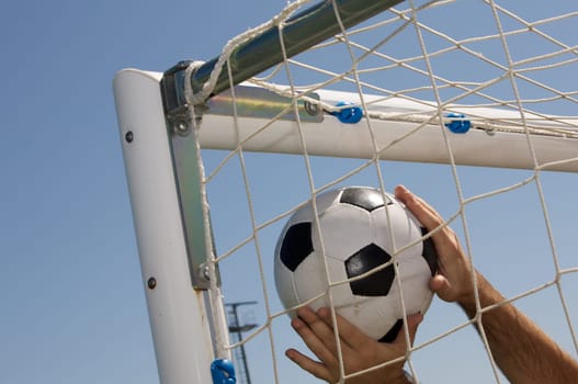 Soccer ball in the goal net