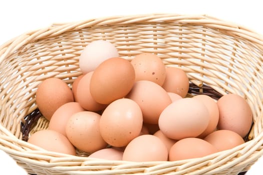 Basket with a lot of hen eggs