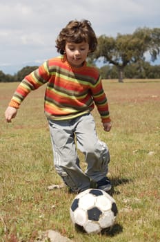 Child playing soccer