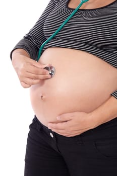 Pregnant examined with a stethoscope