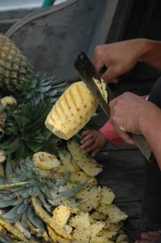 Cutting pineapple