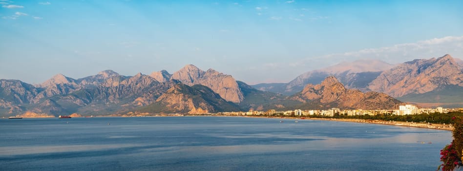 Panoramic view of Antalya Konyaalti coast and cargo port at sunrise in the morning