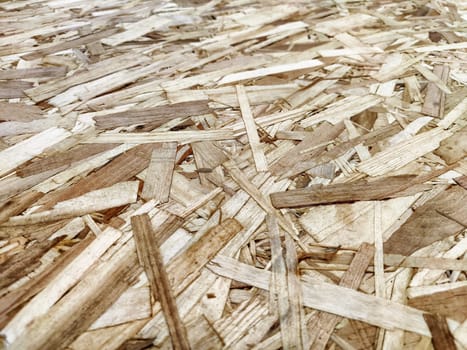 The structure of pressed wood chipboard. Board and sawdust. Background, texture, pattern, place for text, copy space