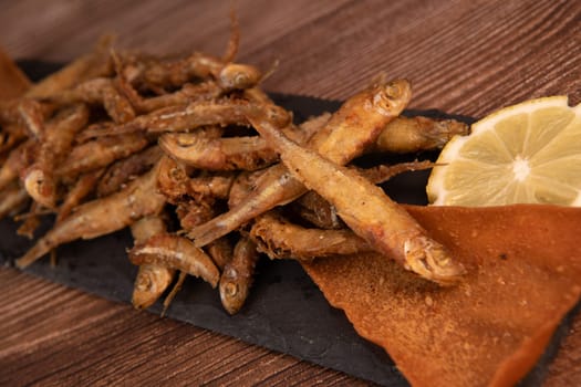DEEP FRIED SEEFOOD, RECIPE FOR FISH, Smelt AND FRIED PITA, LEMON. High quality photo