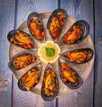 RECIPE FOR SPANISH MUSSELS WITH CHORIZO, WHITE WINE SAUCE, PEPPER, TOMATO, ONION. High quality photo