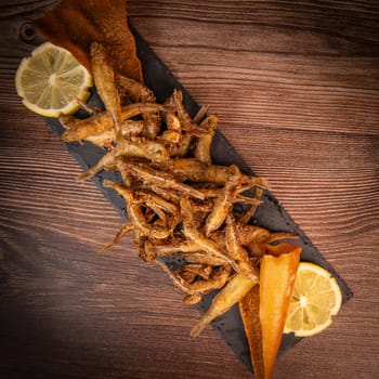 DEEP FRIED SEEFOOD, RECIPE FOR FISH, Smelt AND FRIED PITA, LEMON. High quality photo
