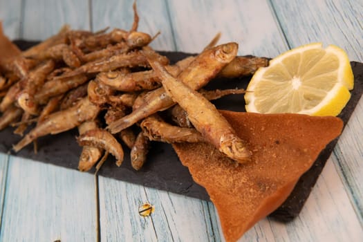 DEEP FRIED SEEFOOD, RECIPE FOR FISH, Smelt AND FRIED PITA, LEMON. High quality photo