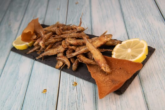 DEEP FRIED SEEFOOD, RECIPE FOR FISH, Smelt AND FRIED PITA, LEMON. High quality photo