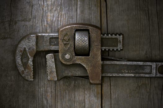 Old Wrench on Wooden Bench