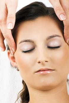 Relaxed woman having a head massage
