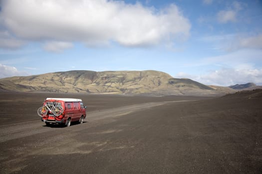 Driving through the lava sand desert