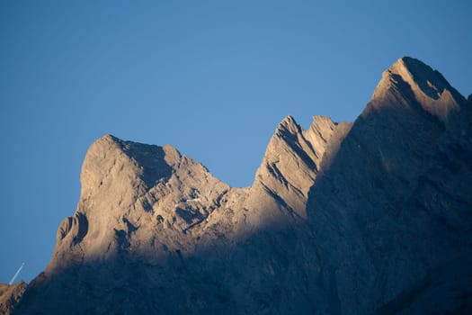 Mountain peaks in the morning sun