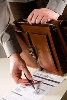 Businessman pointing at financial report
