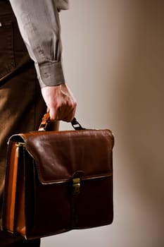 Businessman carries suitcase