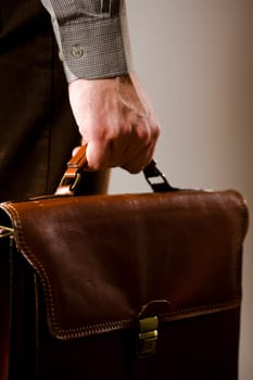 Business man holding briefcase