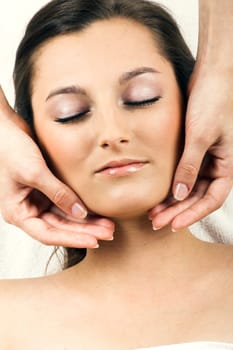 Relaxed woman having a head massage