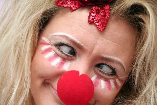 costumed woman with red nose